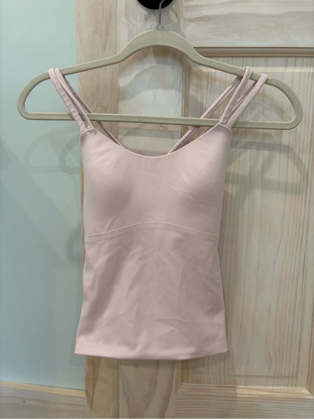 Women's Pink Strappy Tank Top and blue sports bra